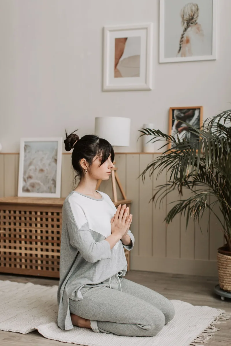 Person practicing mindful breathing in a quiet room