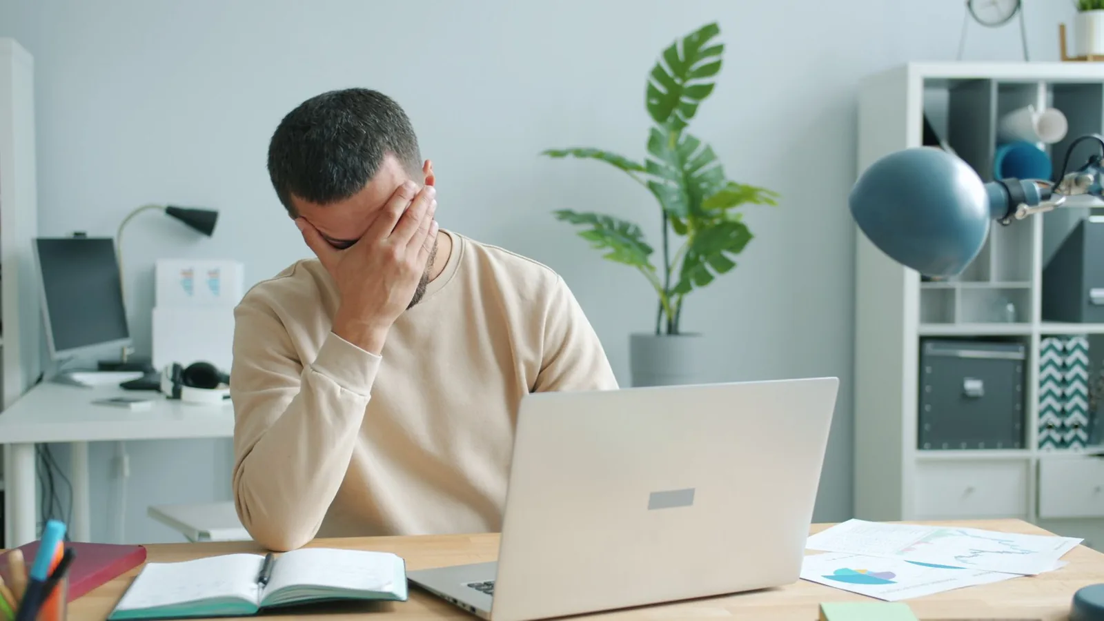 Adult taking a slow breathing pause beside an open window