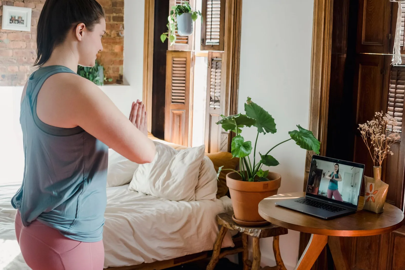 Adult practicing accessible yoga at home with natural light