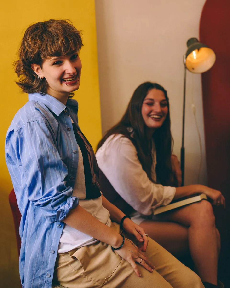 Two adults speaking with care during a difficult conversation