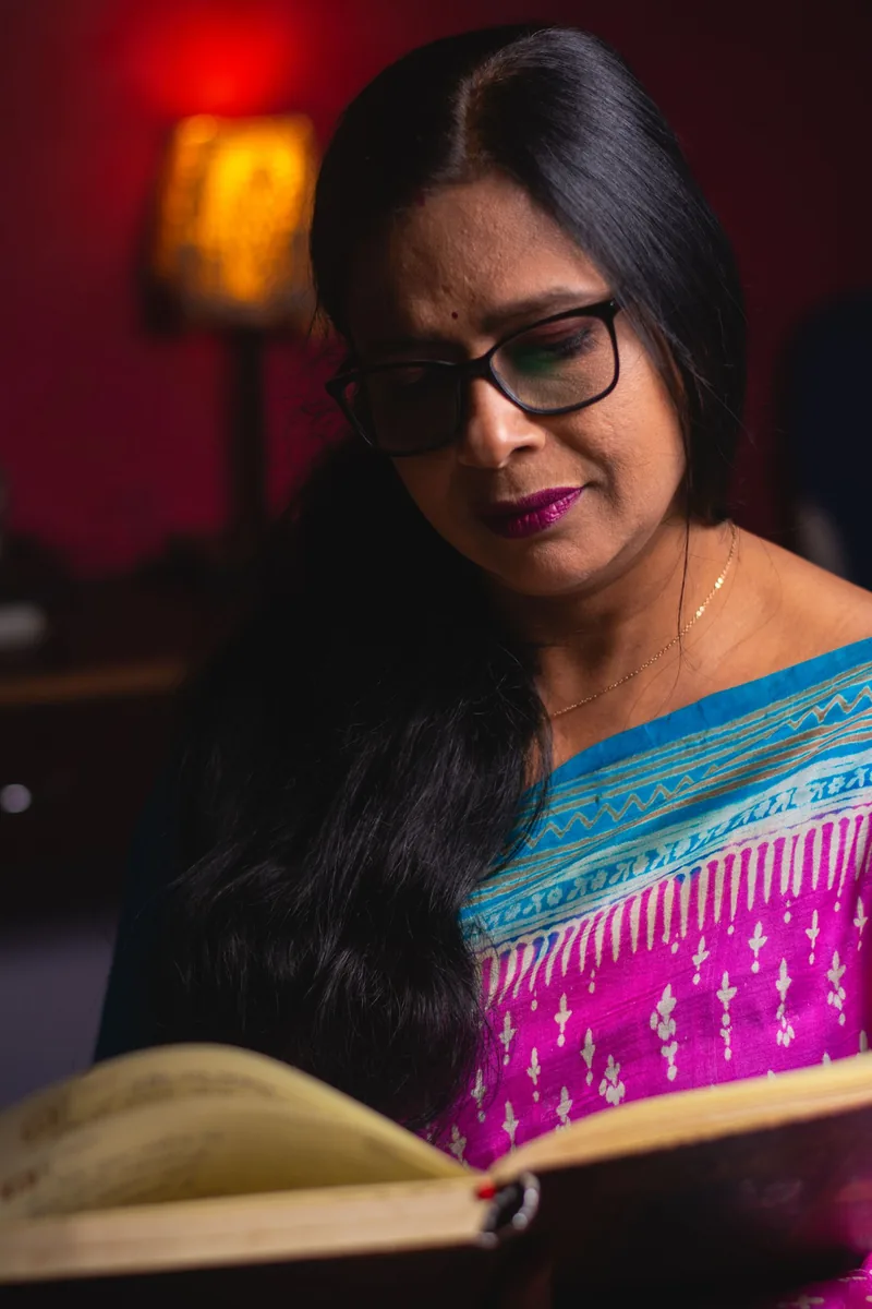 Indian woman reading quietly in a comfortable home