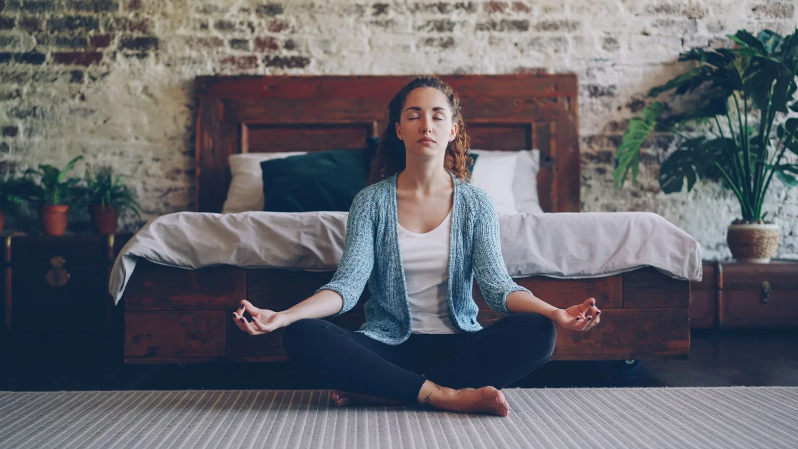 Person practicing a simple seated meditation at home